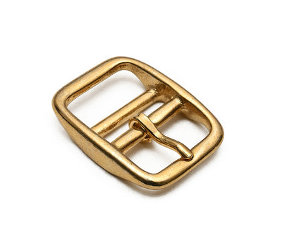 Gold metal buckle on a white background